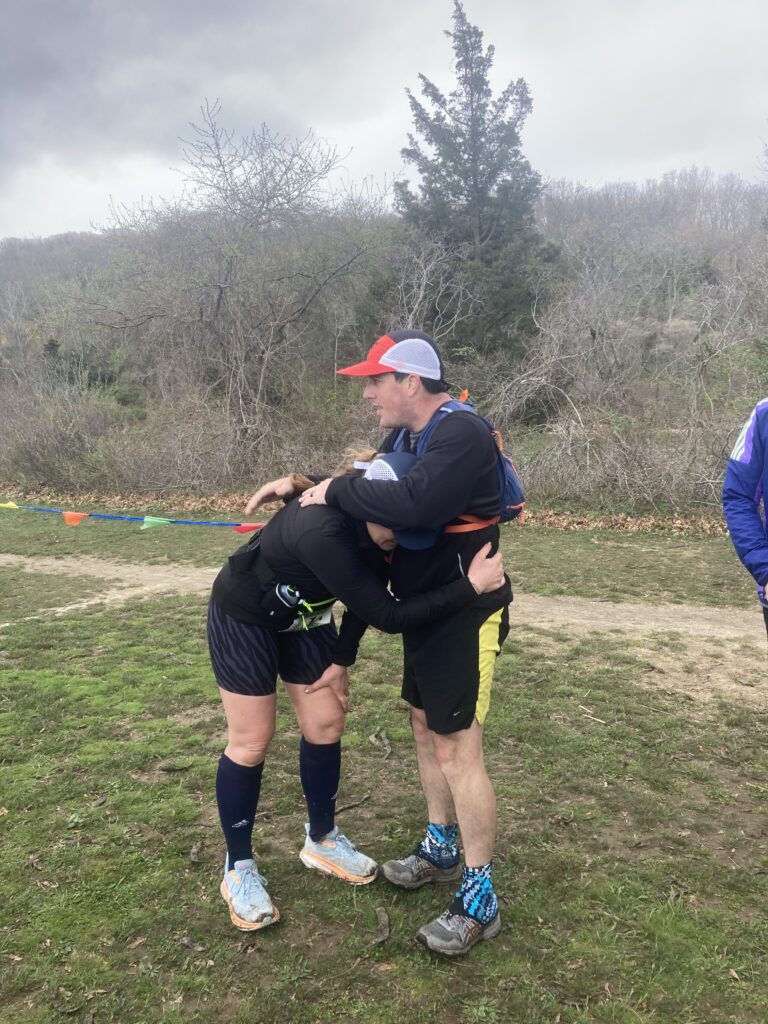 Shore2Shore 50k Finish Line Hug of congratulations