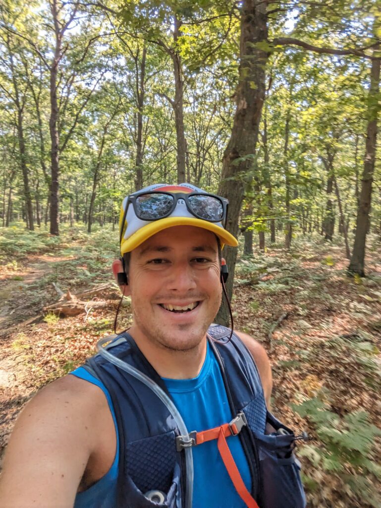 Trail Running with a hydration pack wearing summer running attire